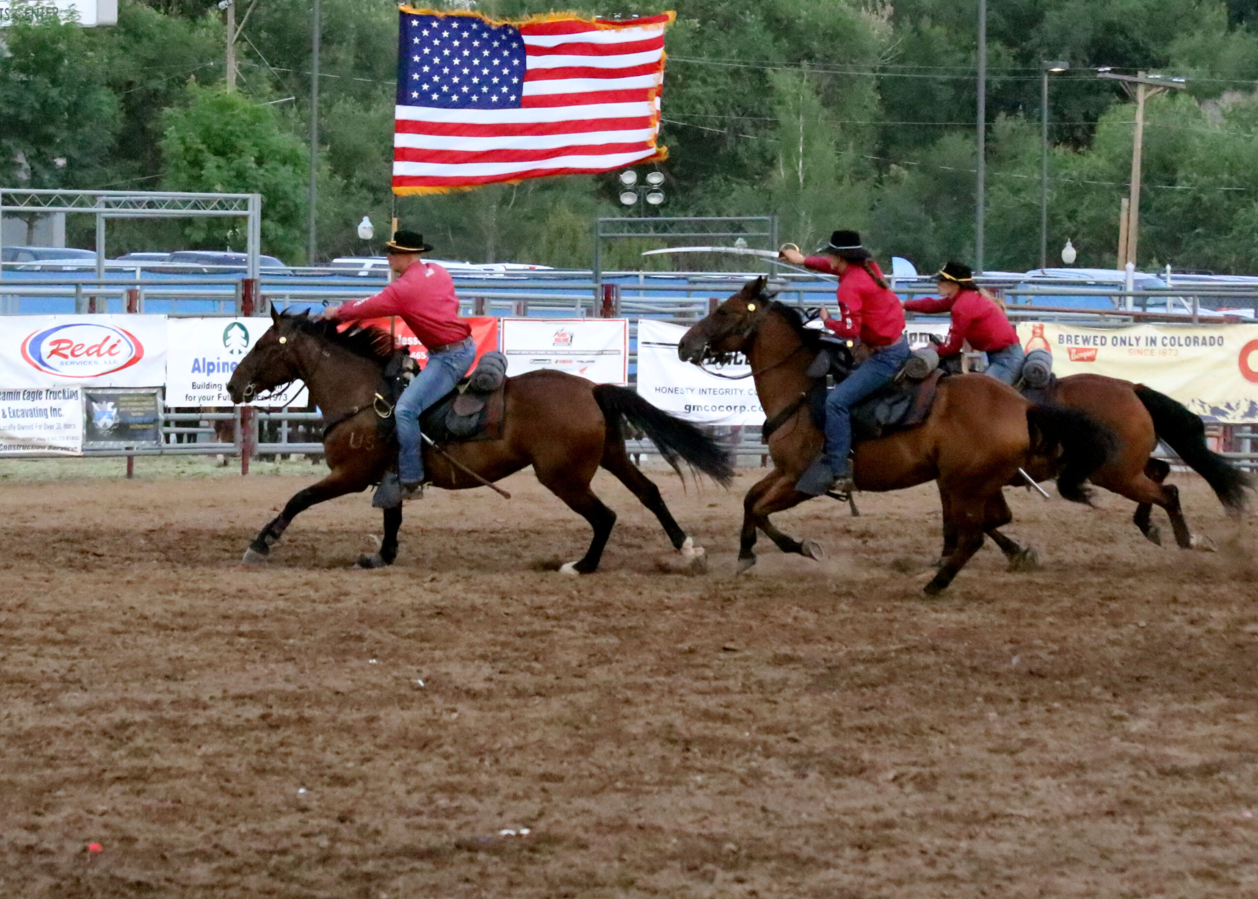 Commanding General's Mounted Color Guard riders with American flag.