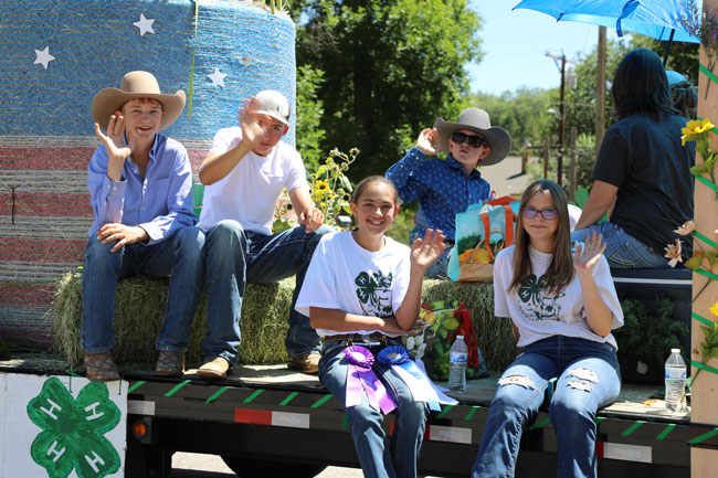 kids in a float on a parade