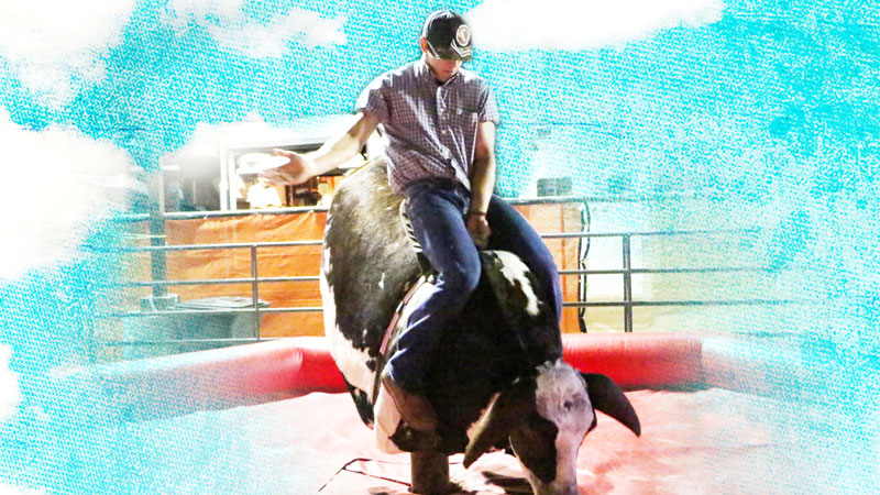 man riding mechanical bull